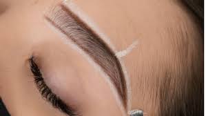 Professional brow shaping service at Downtown Lashes Calgary showing expert eyebrow threading and shaping techniques